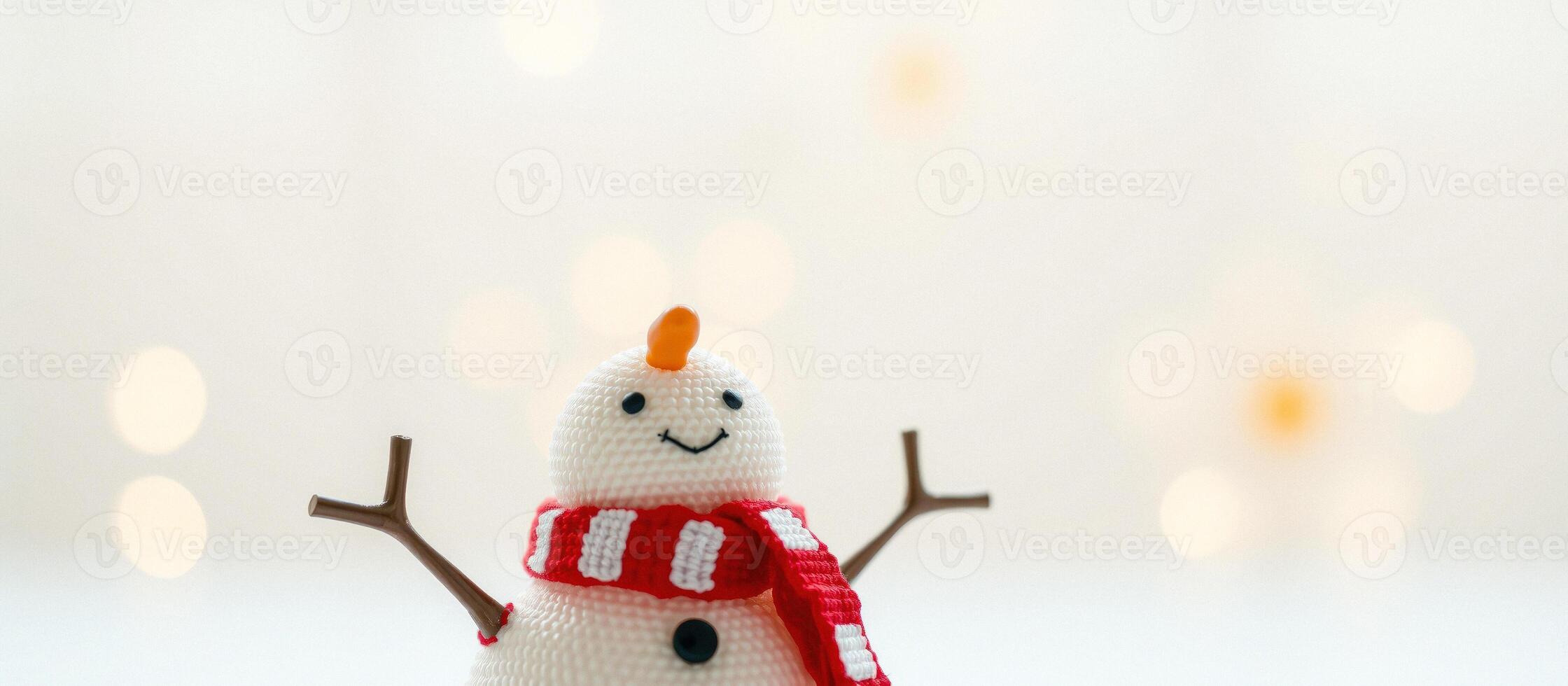 Close-up of a snowman with a red and white scarf photo