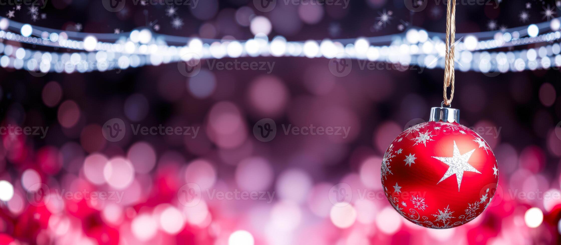 Red Christmas Ornament with Star and Snowflakes on a Bokeh Background photo