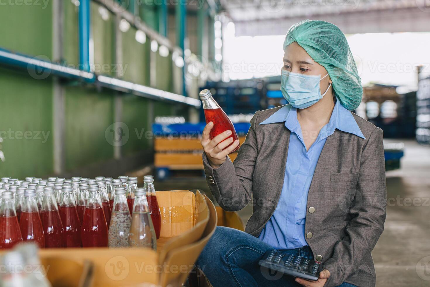 Food and drinks beverage factory industry manager working, Products QC audit staff quality control product inspector checking process drinks bottle. photo