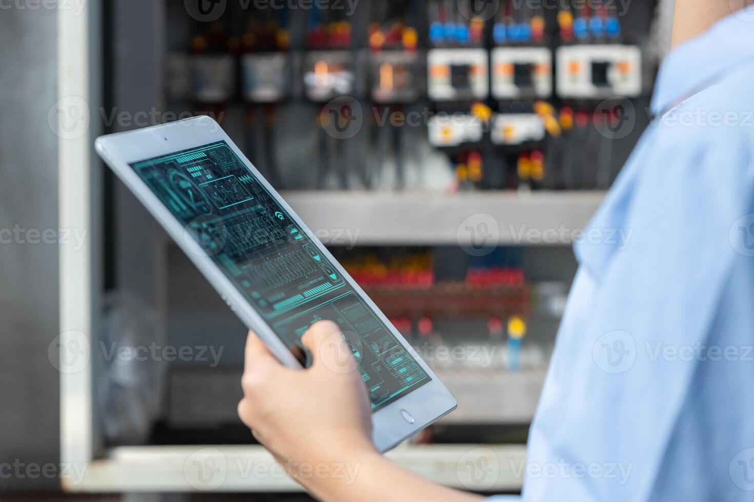 Electrician Engineer woman working check service maintenance electricity main circuit fuse and power system in industry factory photo