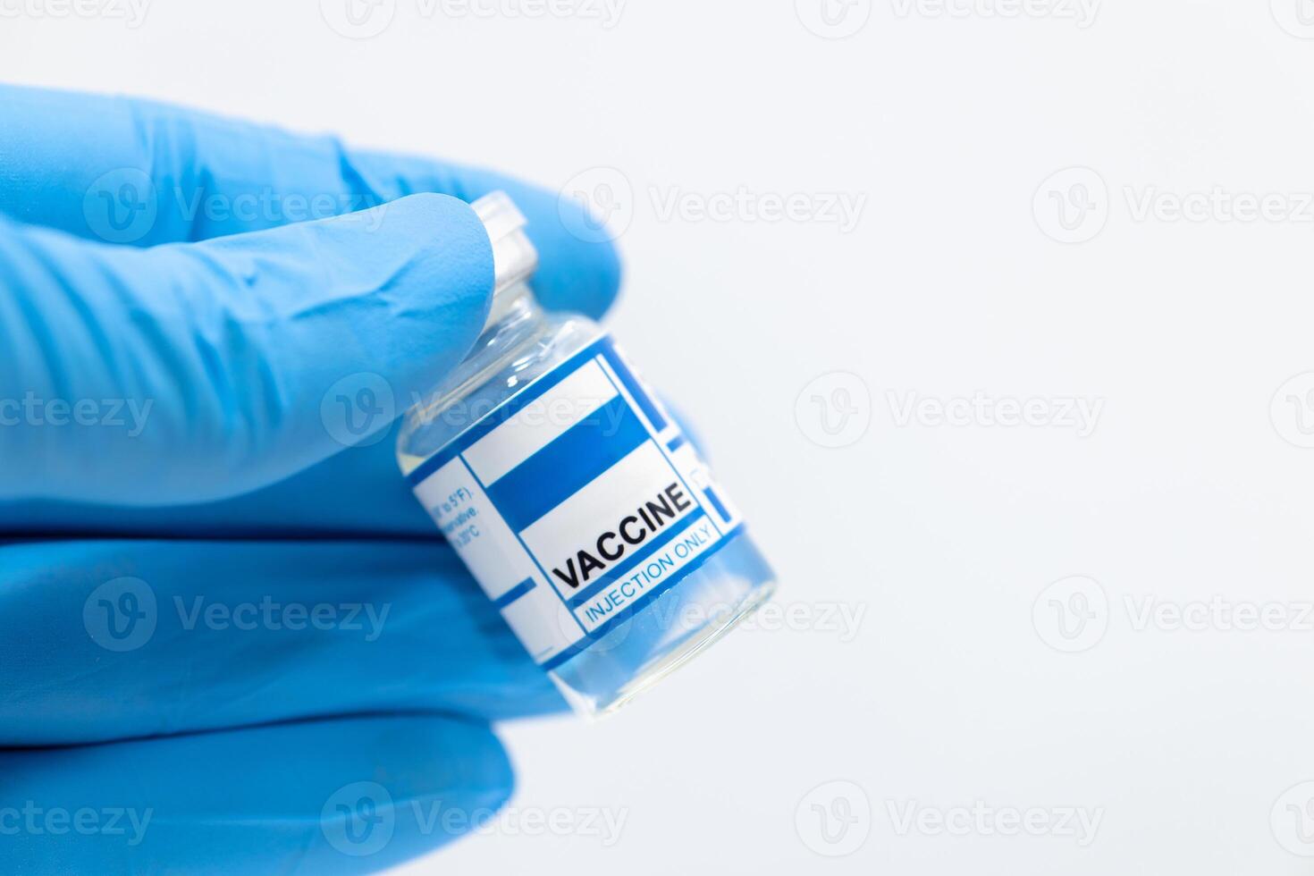Vaccine dose bottle , Anti virus medicine production on hand isolated on white background medical template with space for text. photo