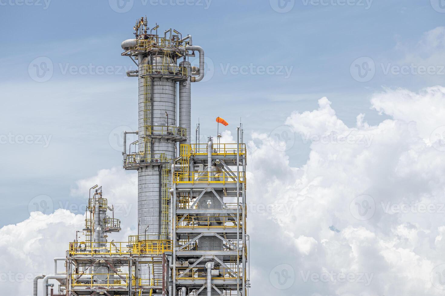 Oil petroleum refinery plant building distillation columns tower, Closeup part of fuel gas pipe complex, Crude oil petrochemical industrial building. photo