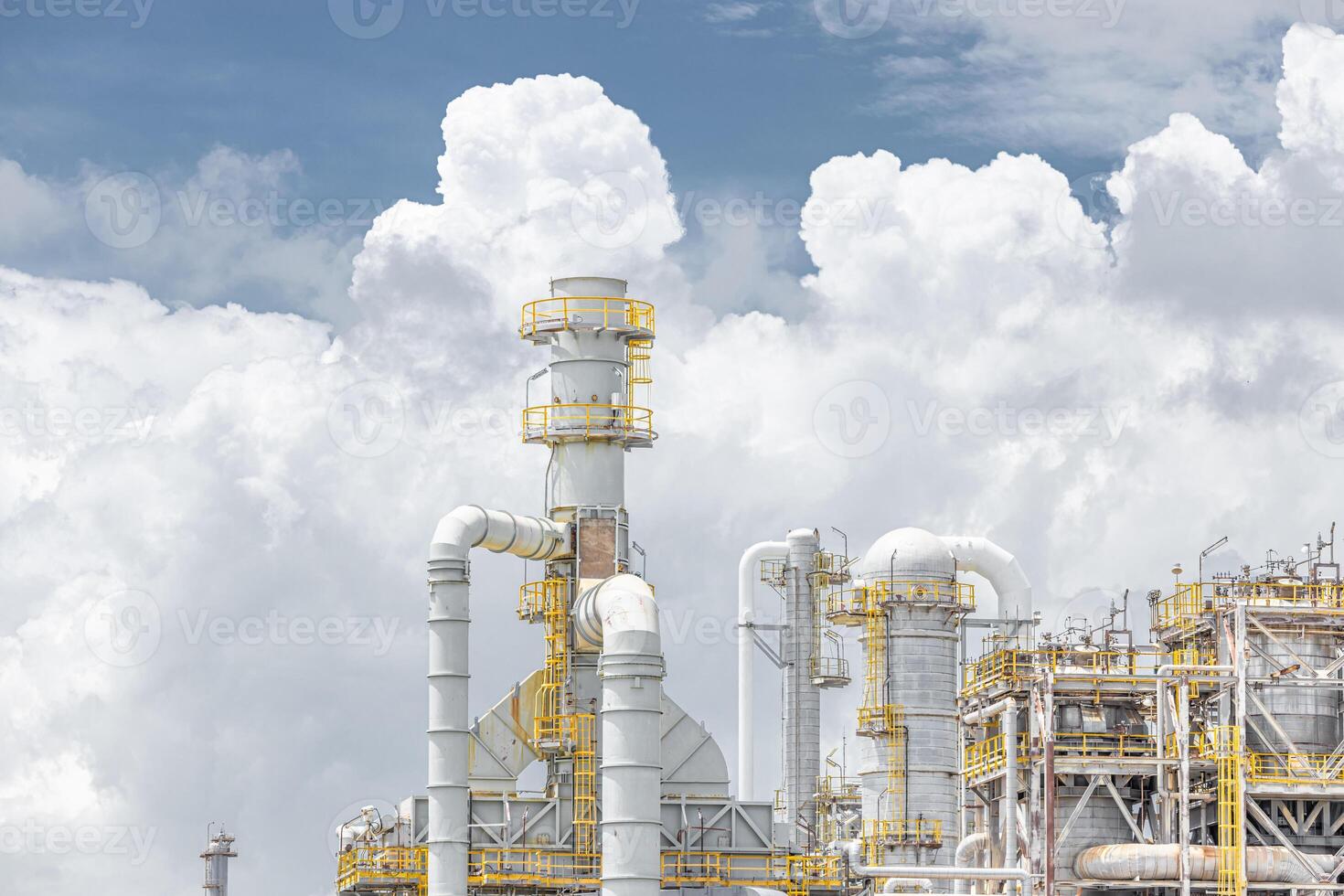 Oil petroleum refinery plant building distillation columns tower, Closeup part of fuel gas pipe complex, Crude oil petrochemical industrial building. photo