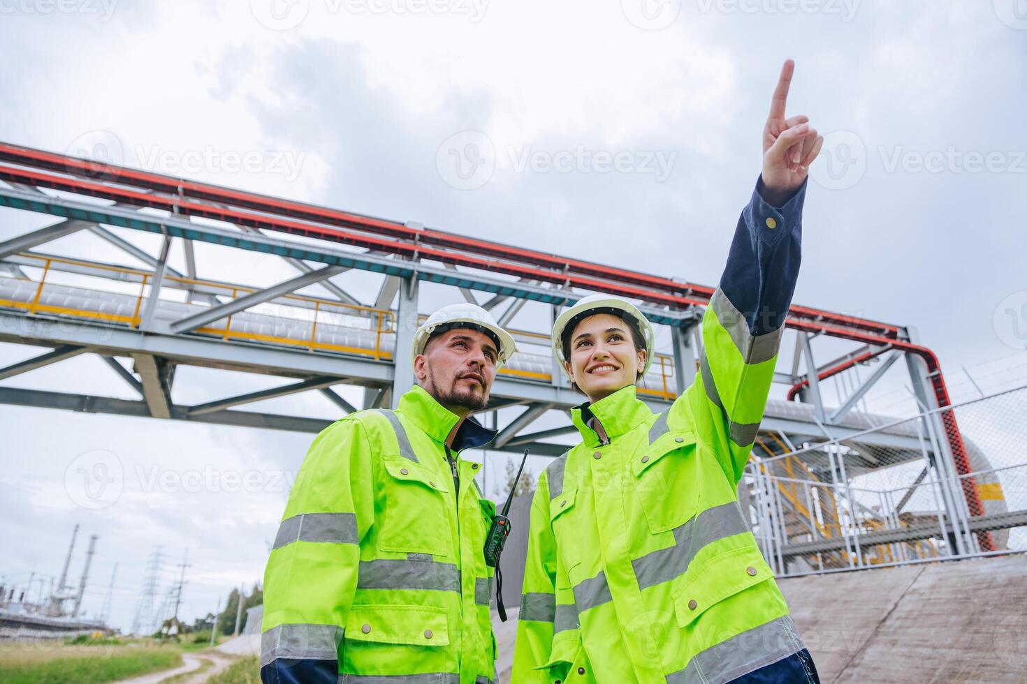 Engineer oil and gas refinery pipe service team worker working together in petroleum pipeline industry. photo