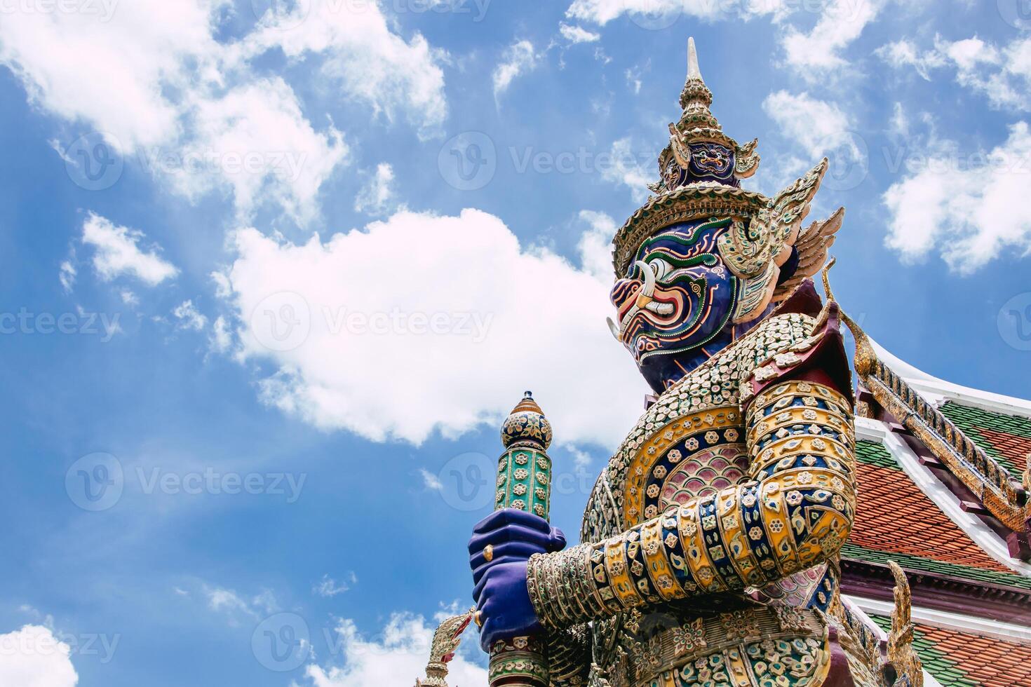 Thai Giant baton gate keeper at Wat Phra Kaew Temple Art statue, Bangkok tourist landmark. photo