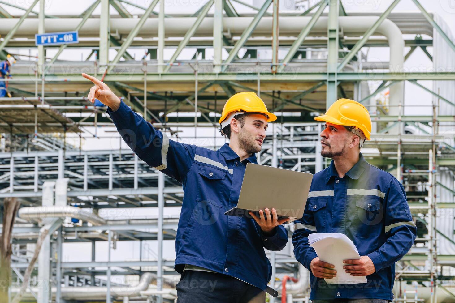 Engineer worker team working outdoor, Surveyor teamwork survey gas pipe oil transport pipeline deploy building project for refinery industry. photo