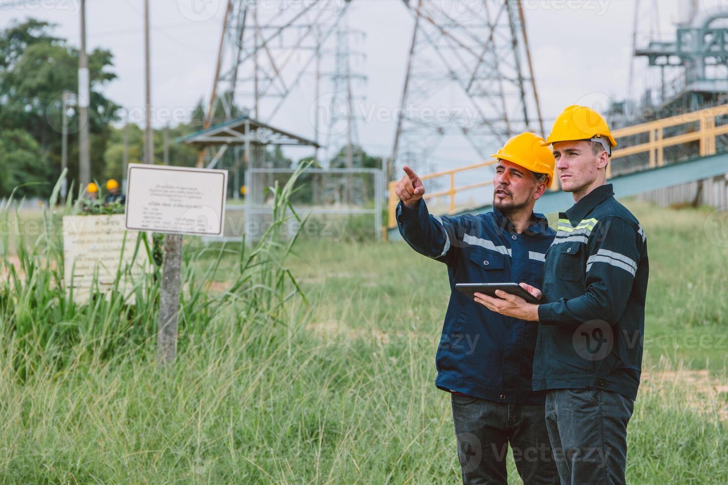 Engineer worker team working outdoor, Surveyor teamwork survey petroleum gas pipe oil transport pipeline and construction building project for refinery industry. photo