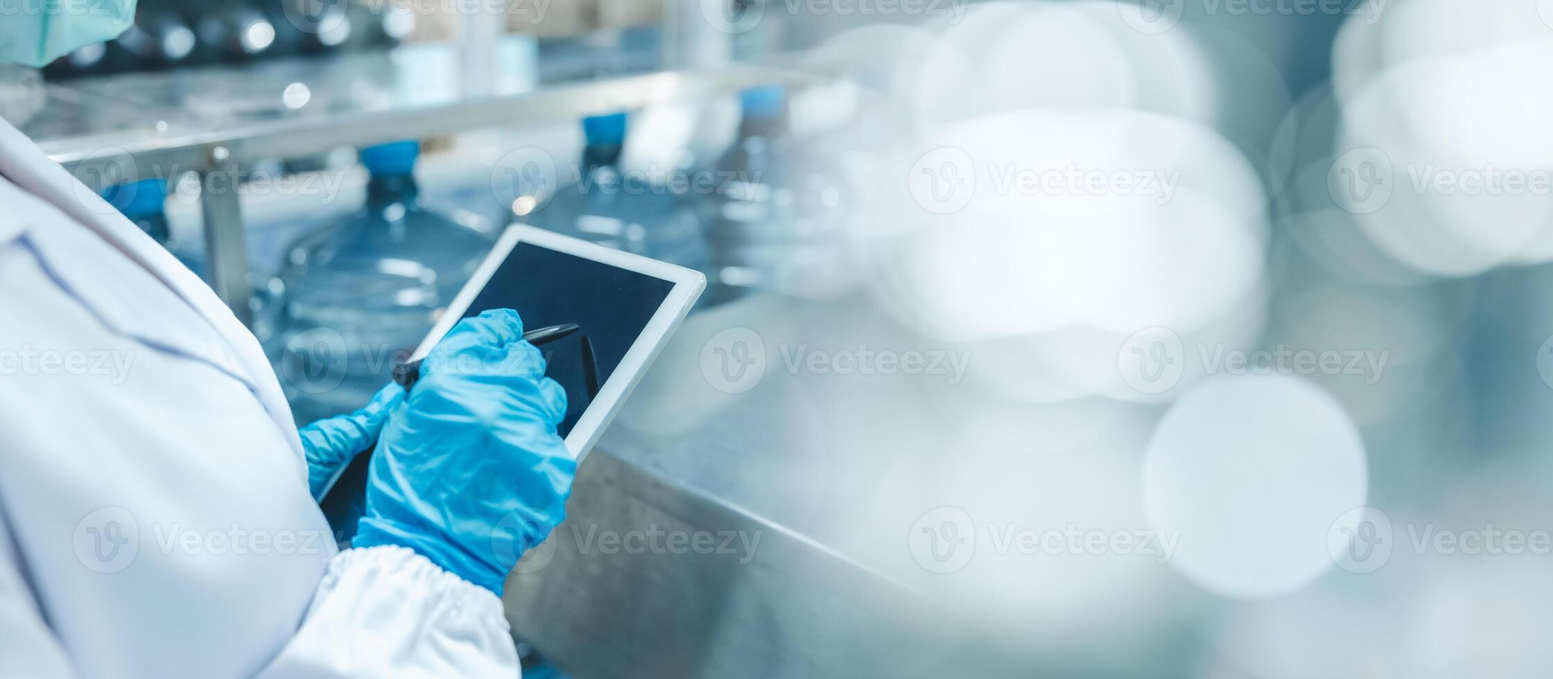 Closeup hygiene worker work with tablet software management technology for manage production in modern factory with space for text photo
