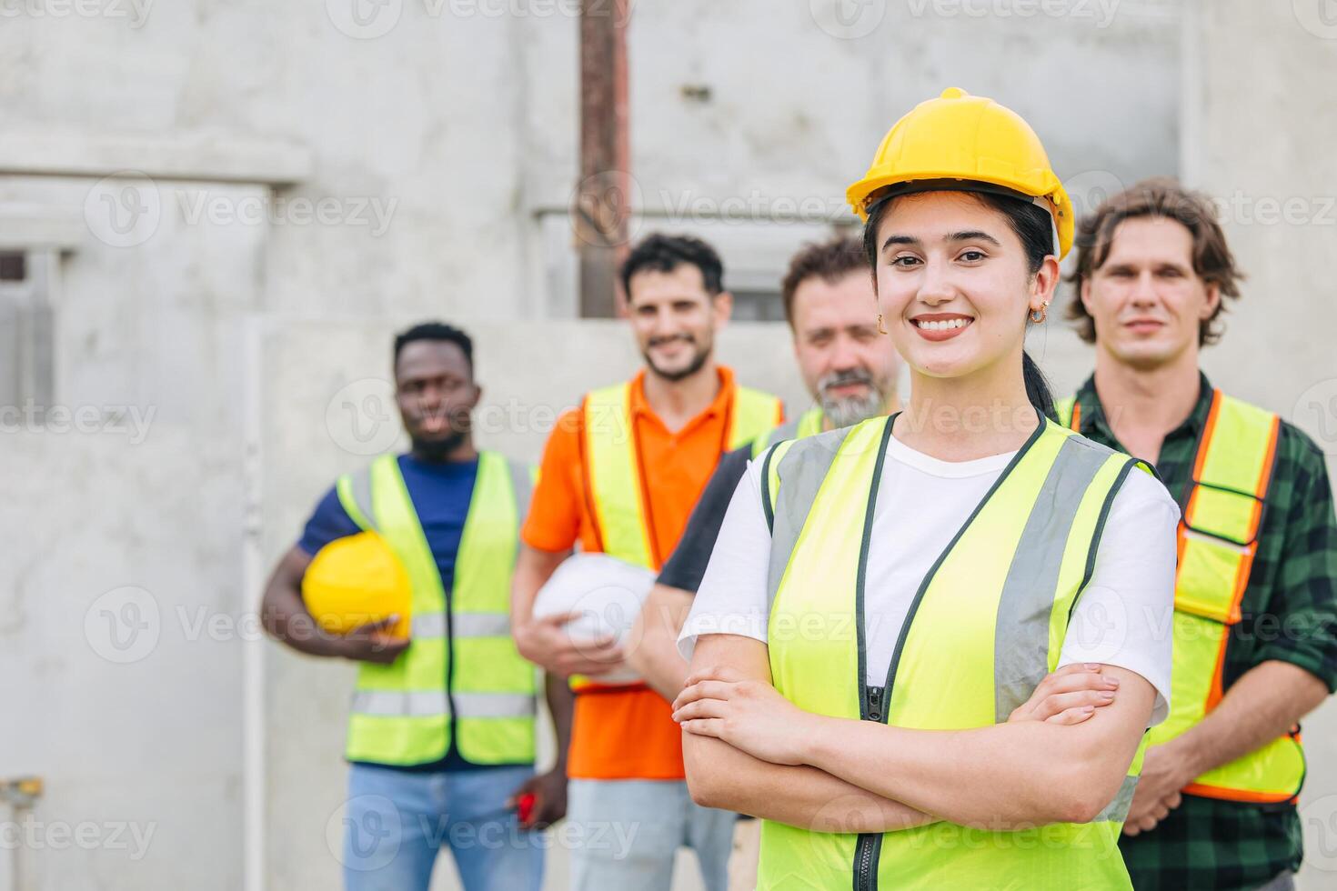 Group of Engineer women leader teamwork happy smiling standing arm crossed, Workers team working together outdoor at construction site. photo