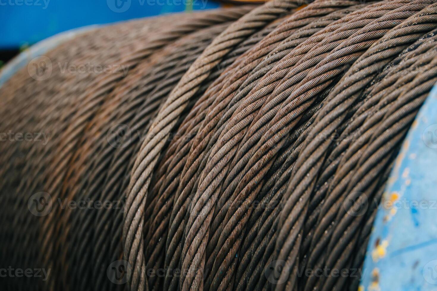 Old Industry Rusty Steel Cable Used Aged Grunge Weathered Steel Wire Or Steel Rope, Rope Sling Drum. photo