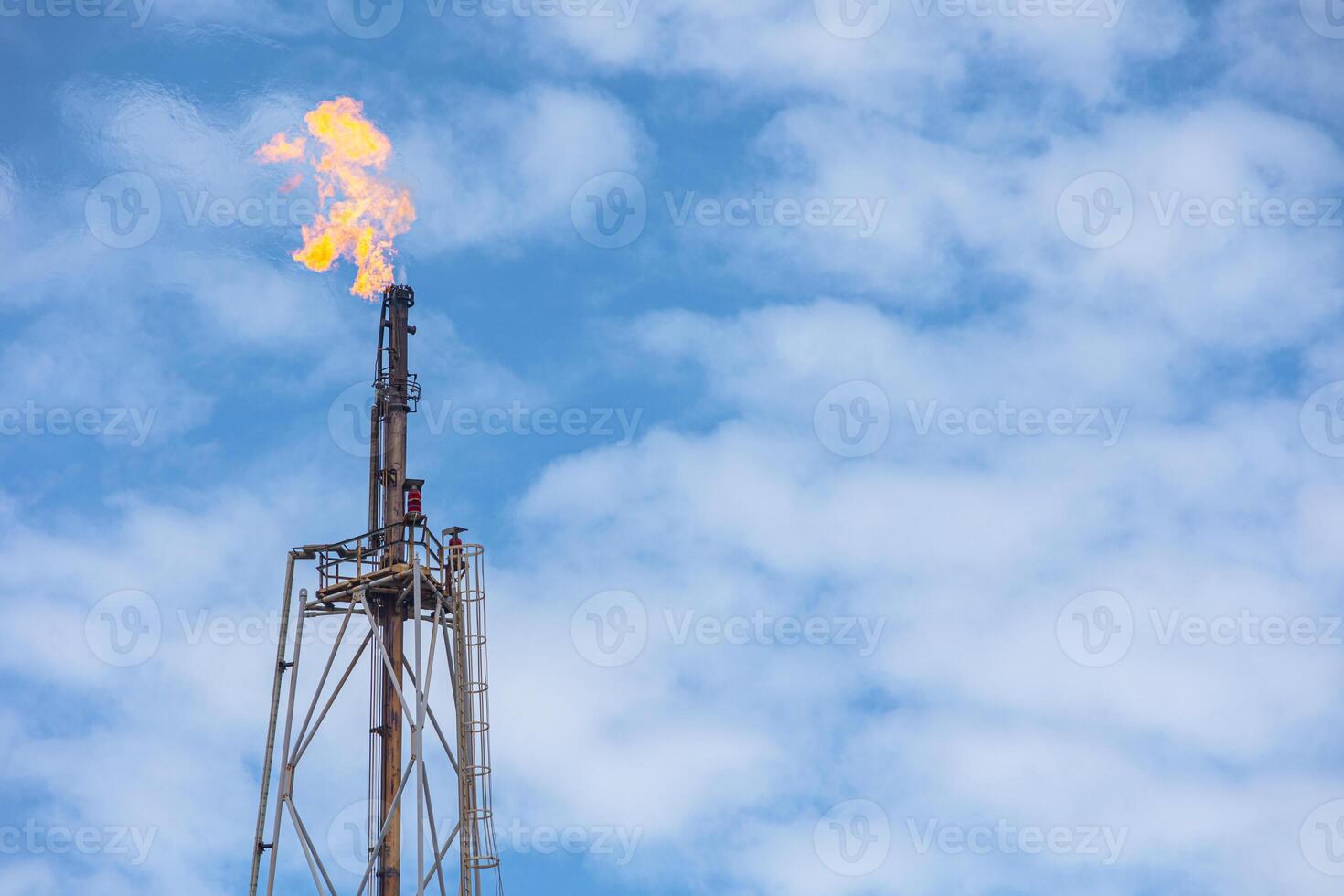 Methane Gas Fire High Flare Stack Flaring Tower Platform in Refinery Petroleum Plant or Flame Burn On Offshore Oil Extraction Process. photo