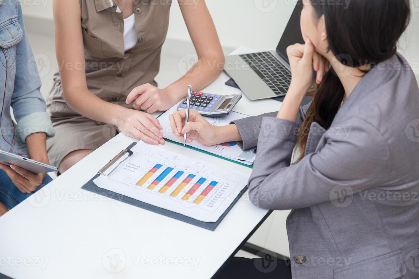 Business women talking with team in office room, Marketing secretary work on the table with manager present information to deciding photo