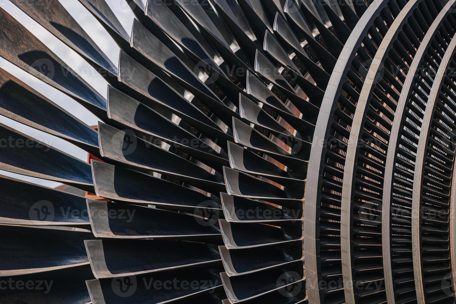 Turbine Blades, High Precision Engineering. Large Fan Stack Layer Metal Part Rotor In Jet Engine Or Steam Power Plant. photo