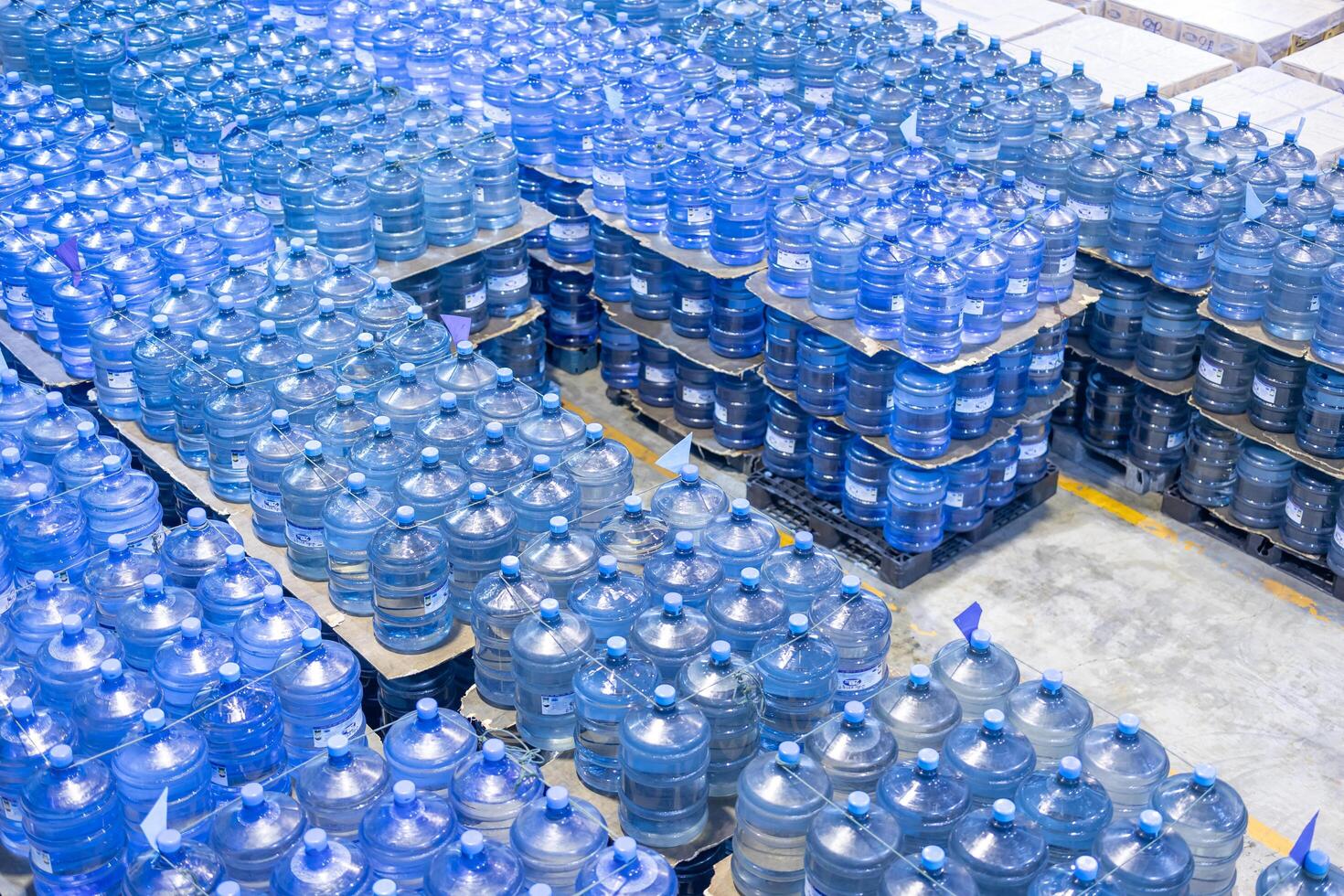 Drinking water plant warehouse product storage room inventory waiting for logistic ship to market process. photo