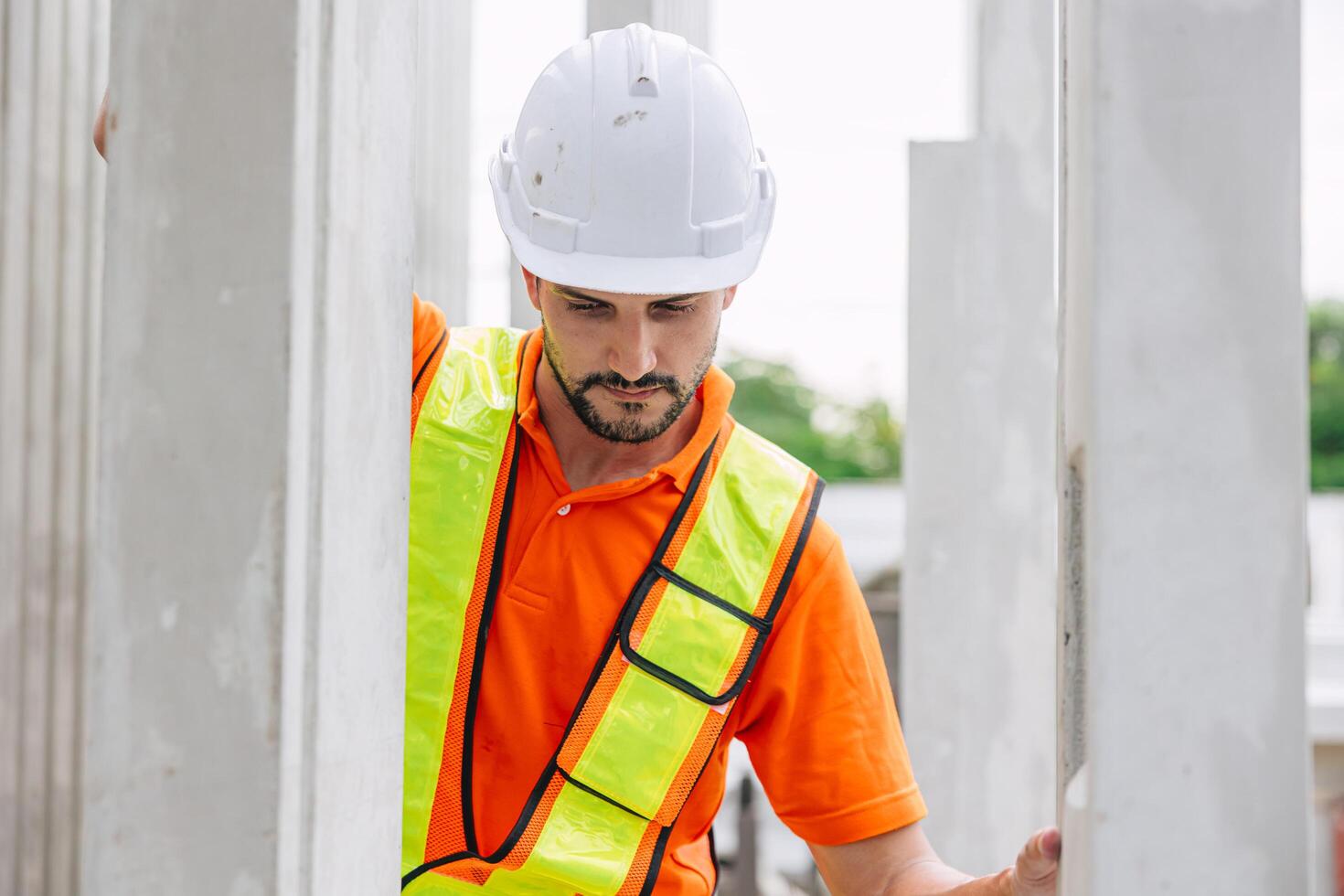 Professional engineer Hispanic Latin male working in concrete precast plant factory control operate construction site. photo