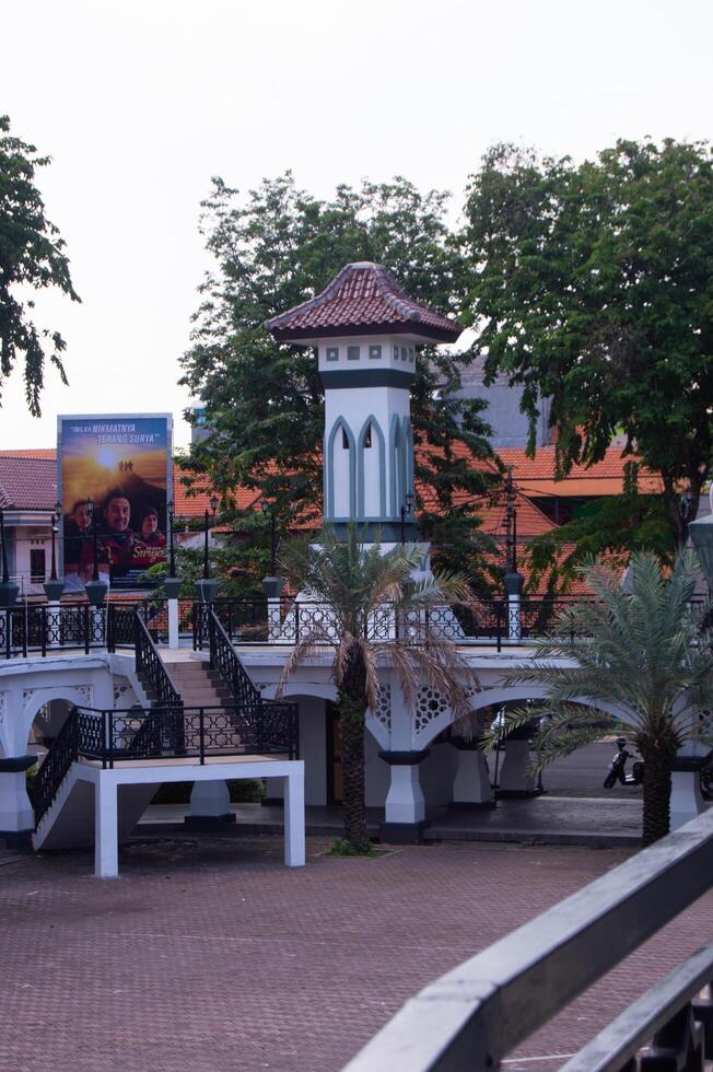 tower building surrounded by shady trees photo