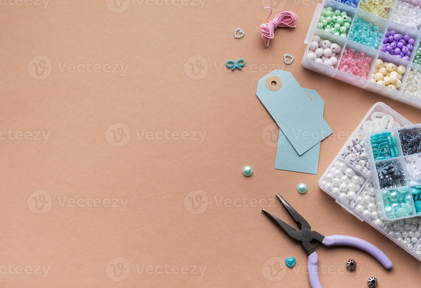 Creating personalized crafts with beads and tags on a light background for various DIY projects photo