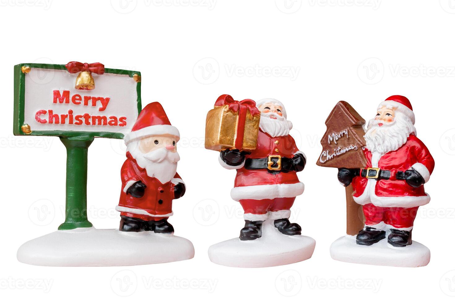 Miniature Santa Claus figurine isolated on a white background with a clipping path photo