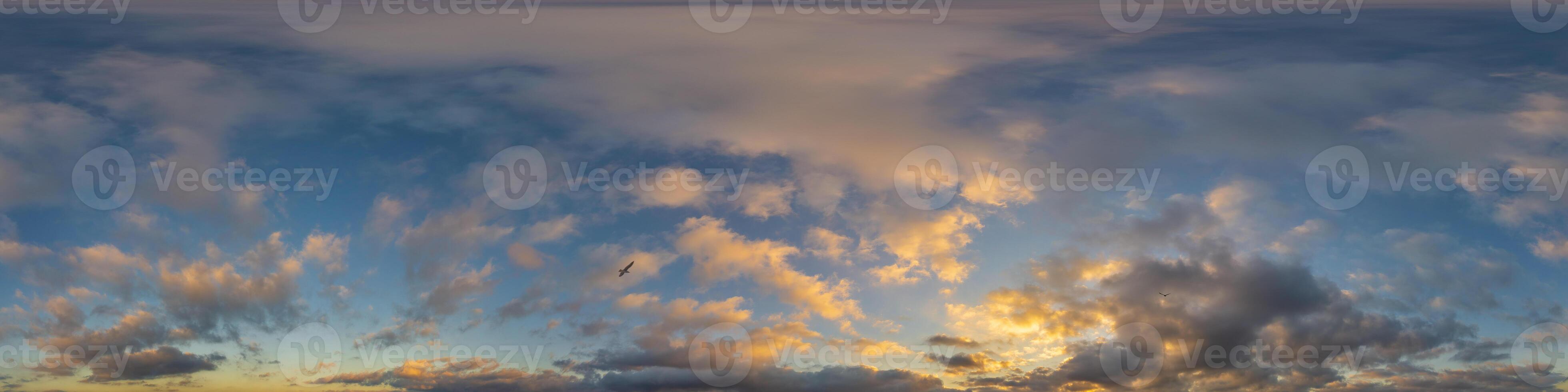 Dark blue sunset sky panorama with golden Cumulus clouds. Seamless hdr 360 panorama in spherical equirectangular format. Full zenith for 3D visualization, sky replacement for aerial drone panoramas. photo