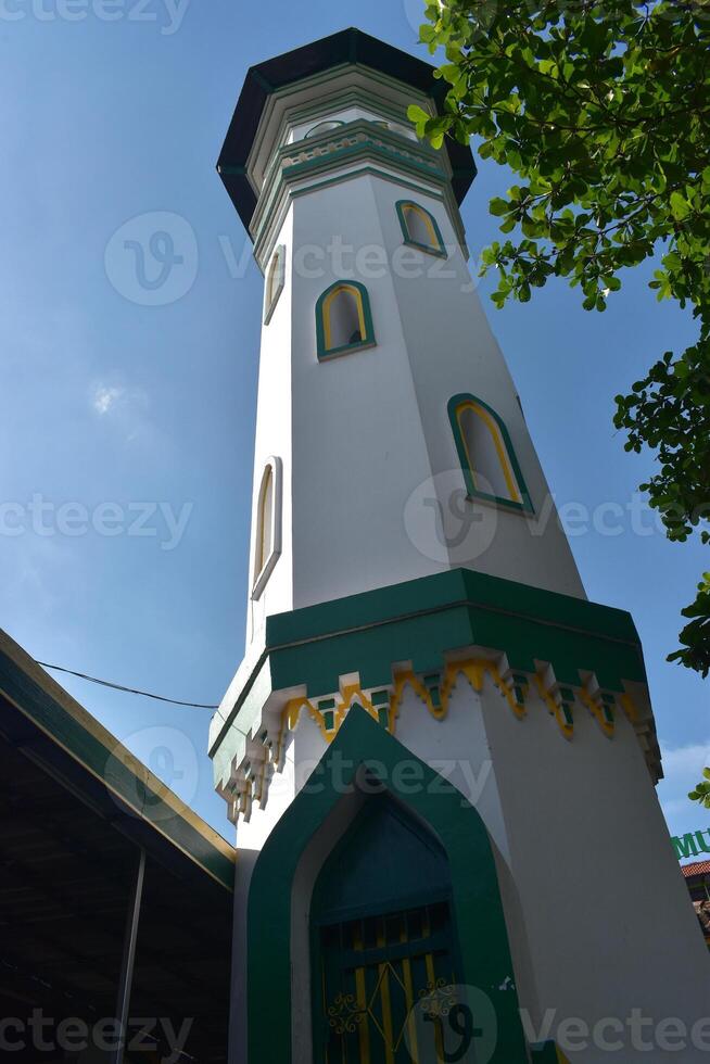 Low angle shot of a mosque minaret photo