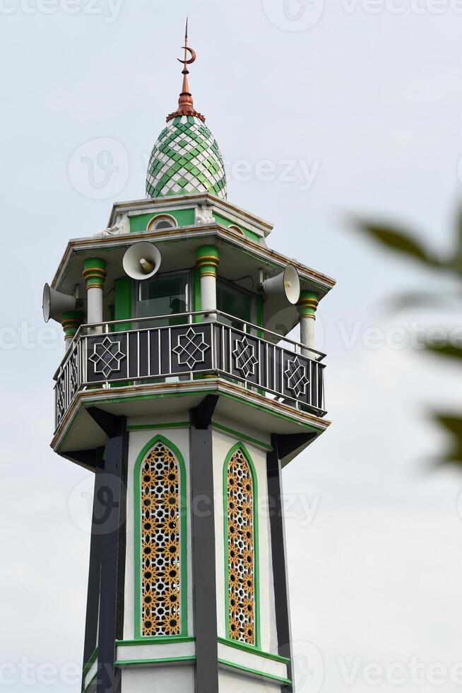 The top part of a mosque minaret photo