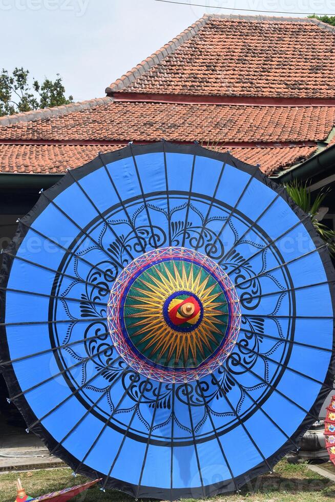 Big blue umbrella with decorative pattern photo