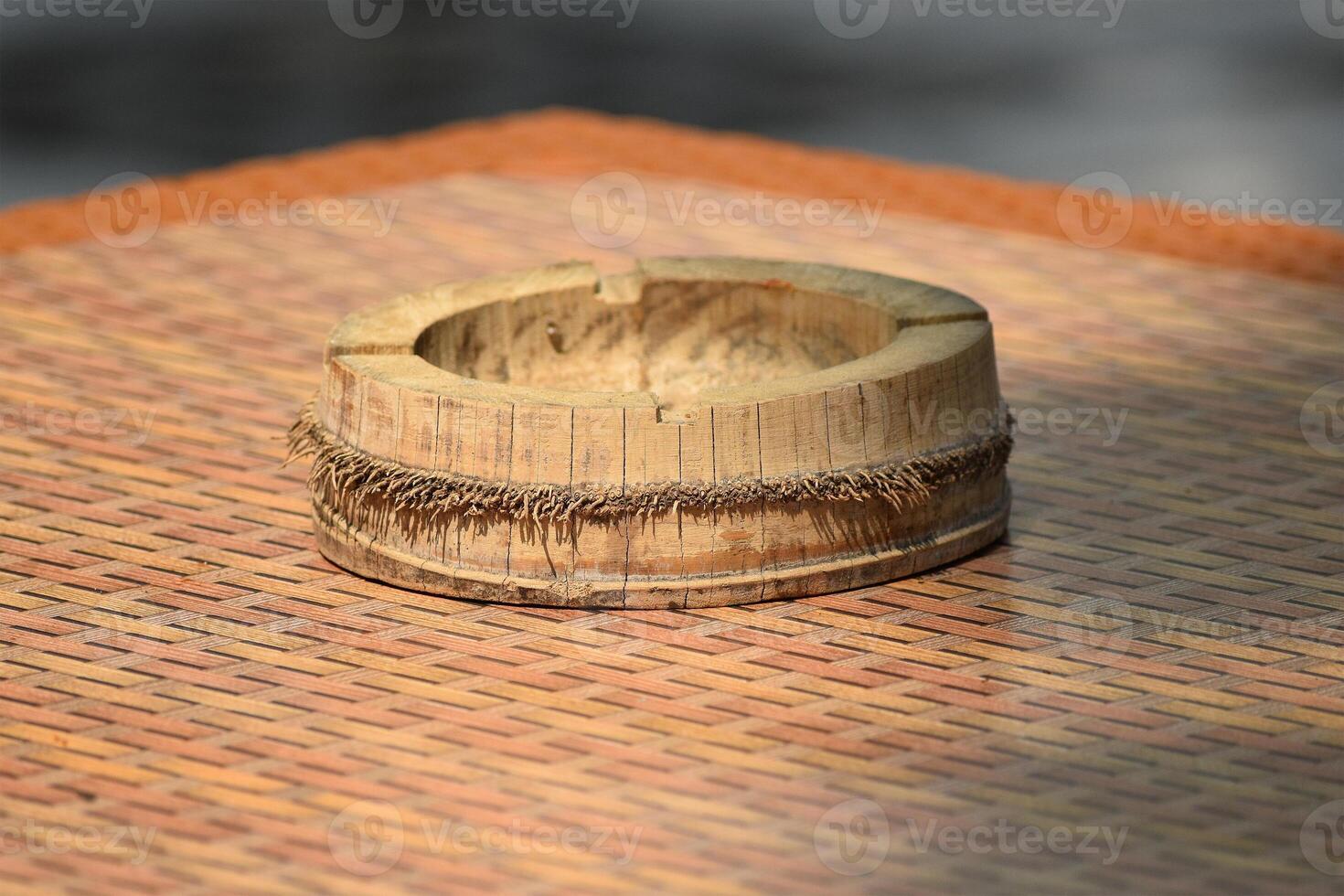 A bamboo ashtray on the table photo