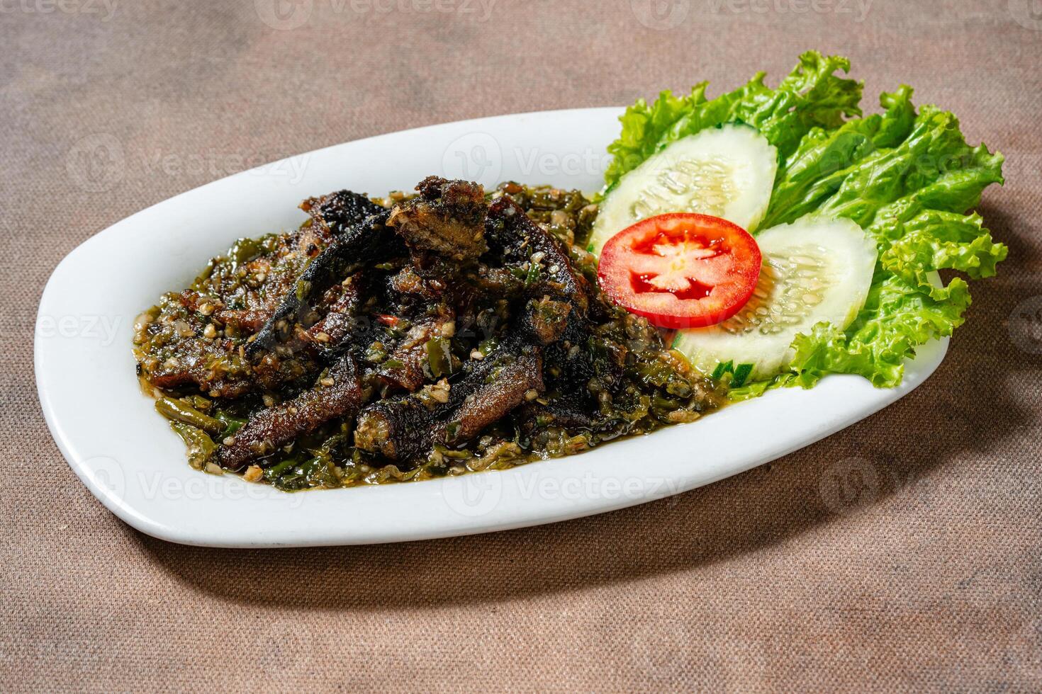 Fried eel with green chili sauce or belut goreng cabe ijo photo