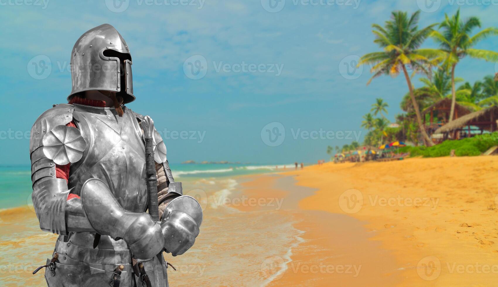 Knight in helmet and metal armor. photo
