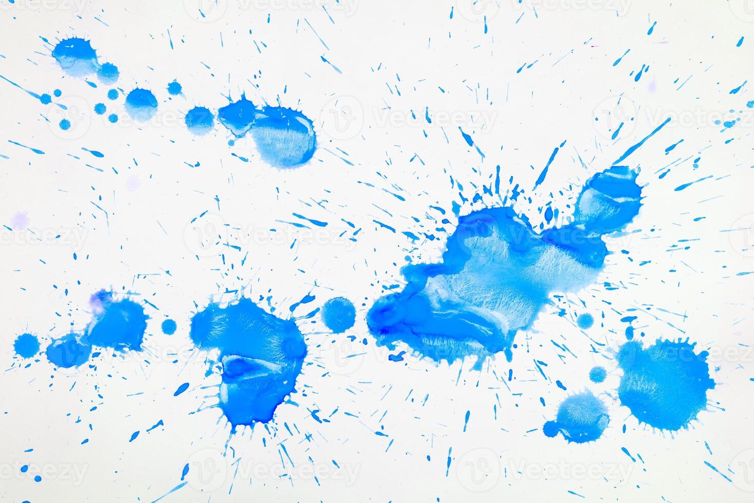 Blue blots and spots on a white background. photo