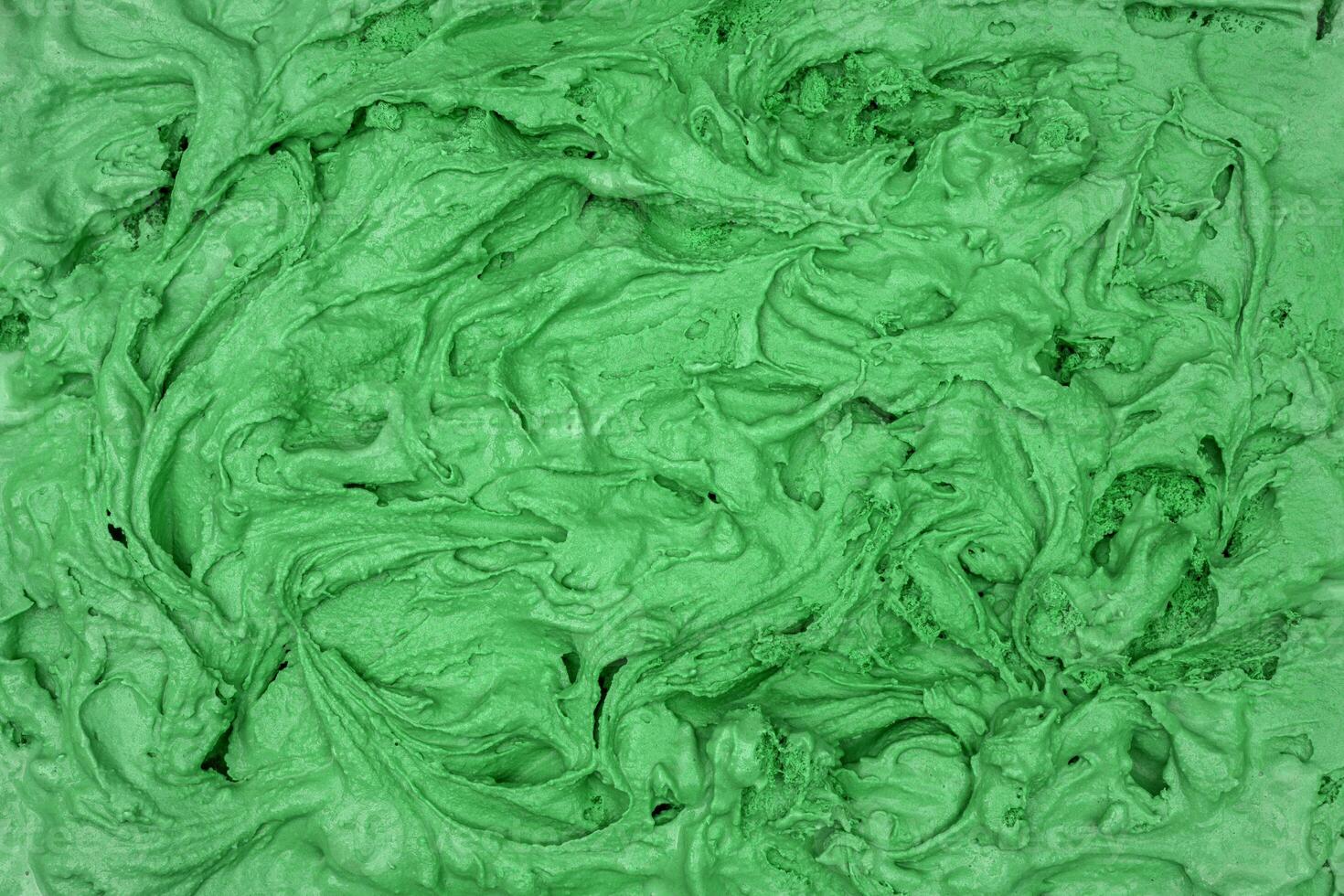 Pistachio ice cream texture. Top view. Delicious cool treat. photo