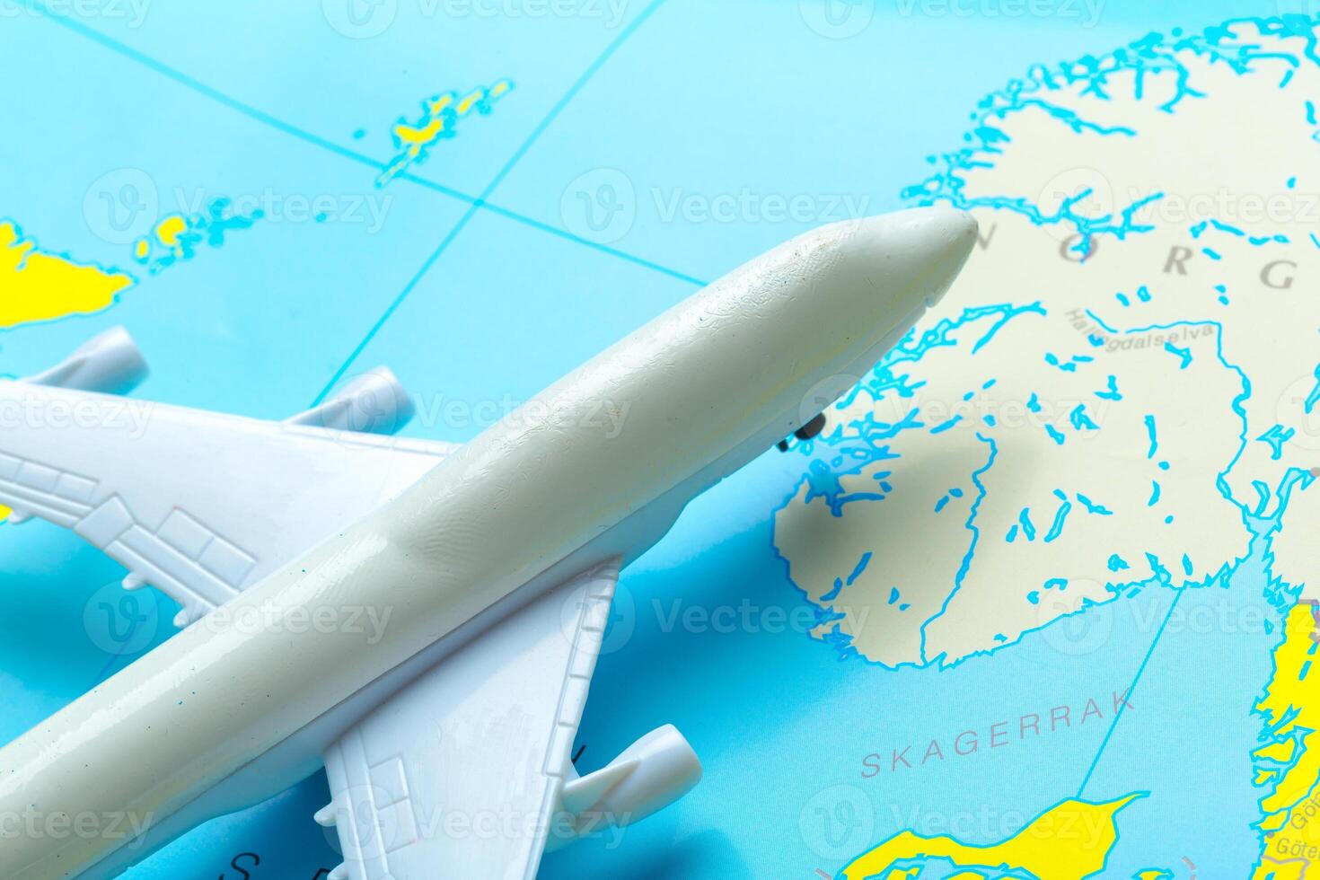 miniature of a passenger aircraft flying on a map photo