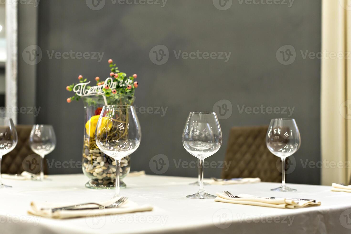 close up of table setting with glasses and cutlery photo