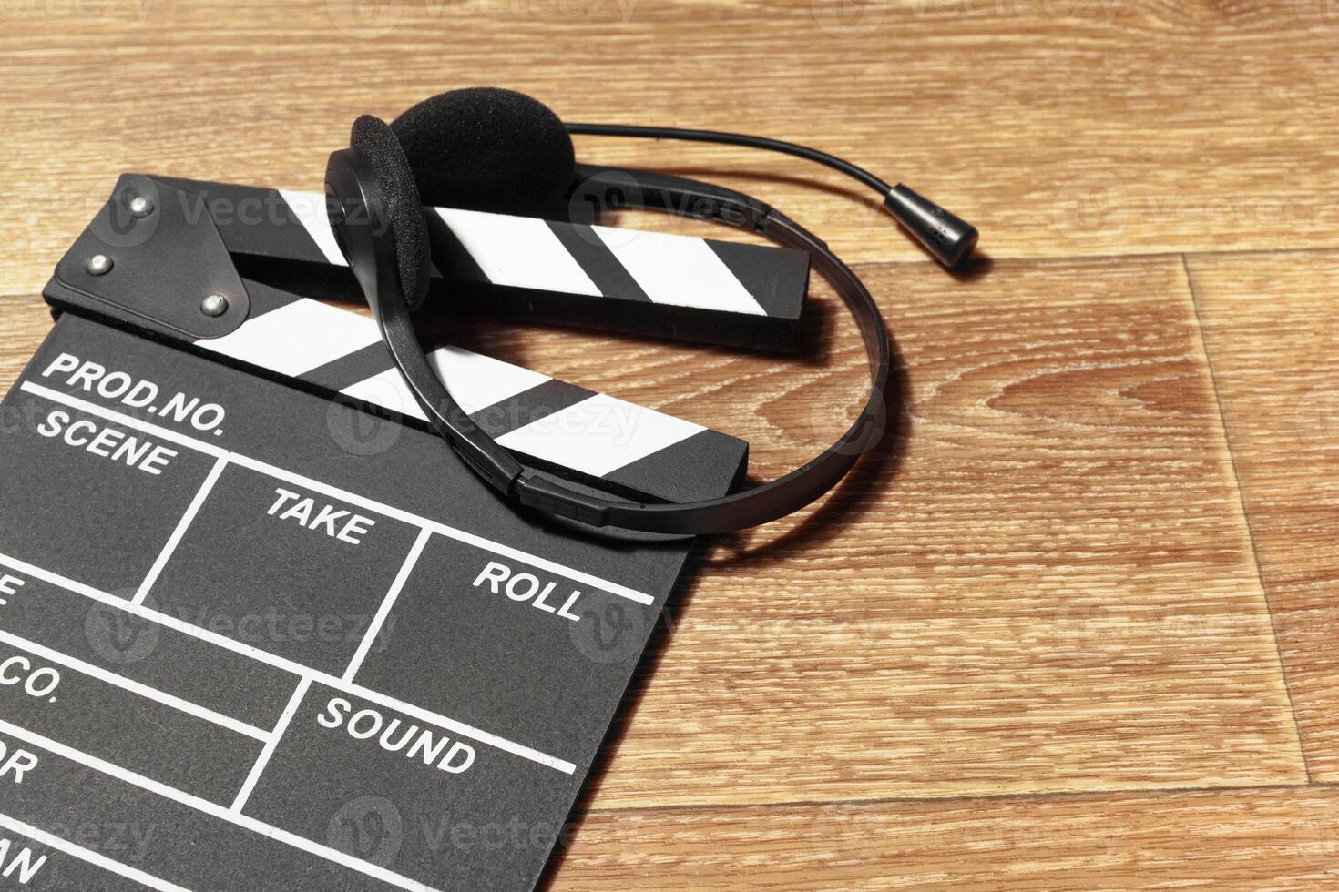 Film clapper board on a table photo