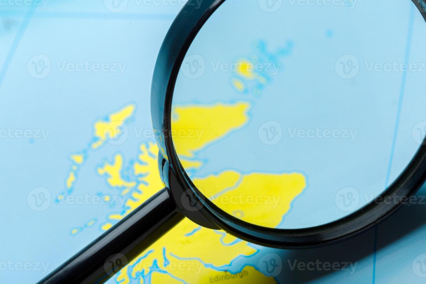 Magnifying glass and map photo