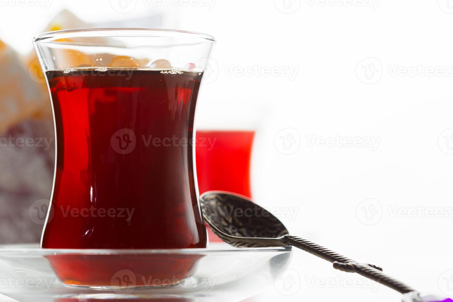 Turkish tea in traditional glass isolated on white background photo