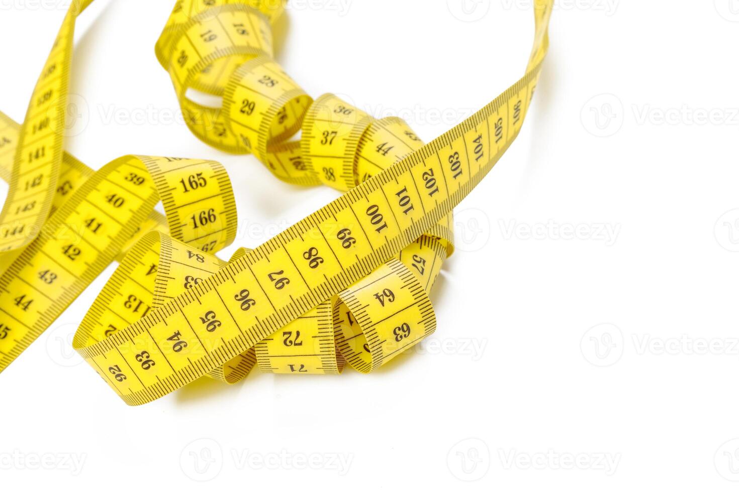 yellow metric measuring tape isolated on white panorama background photo
