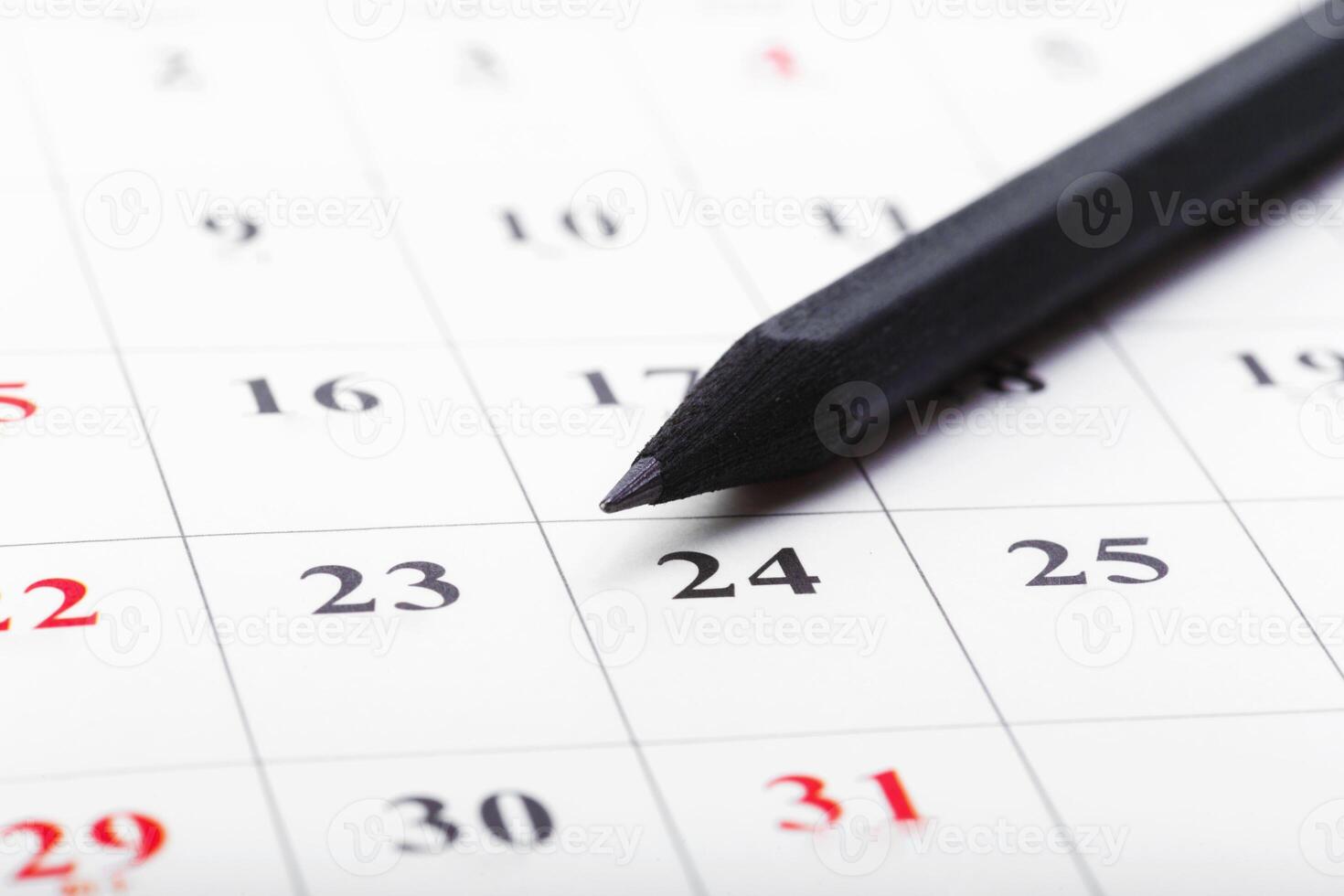 Check out the dates in a business calendar concept photo