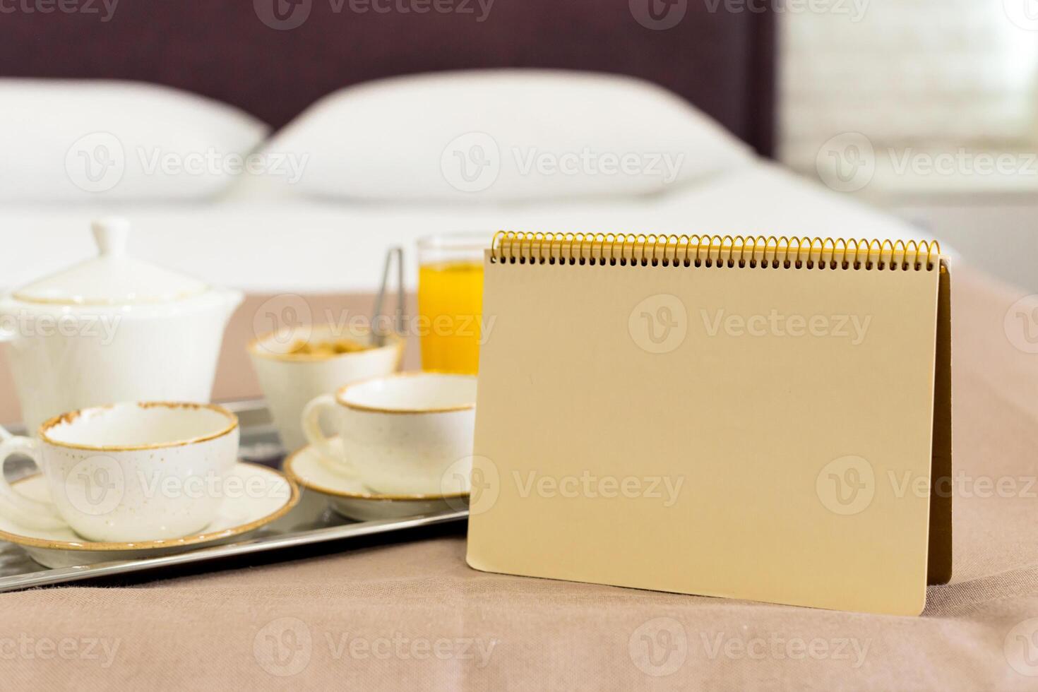 Two white mugs on a tray white bed, breakfast concept photo