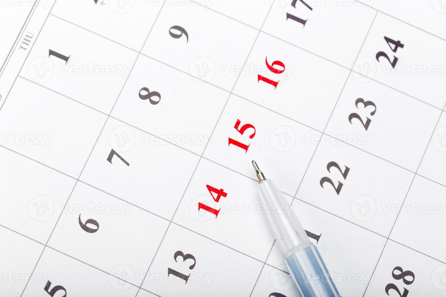 Check out the dates in a business calendar concept photo