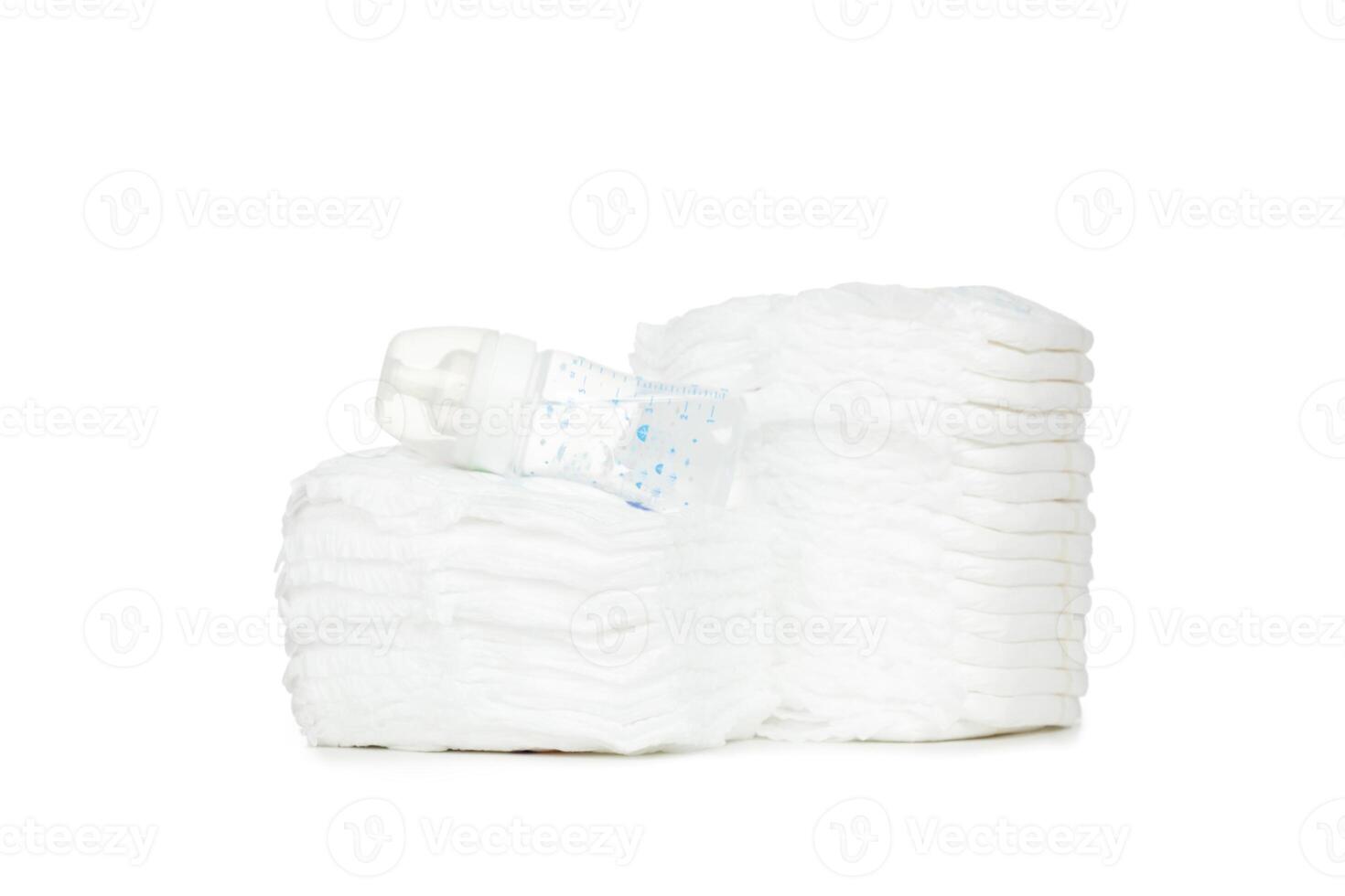 Stack of diapers isolated on white background photo