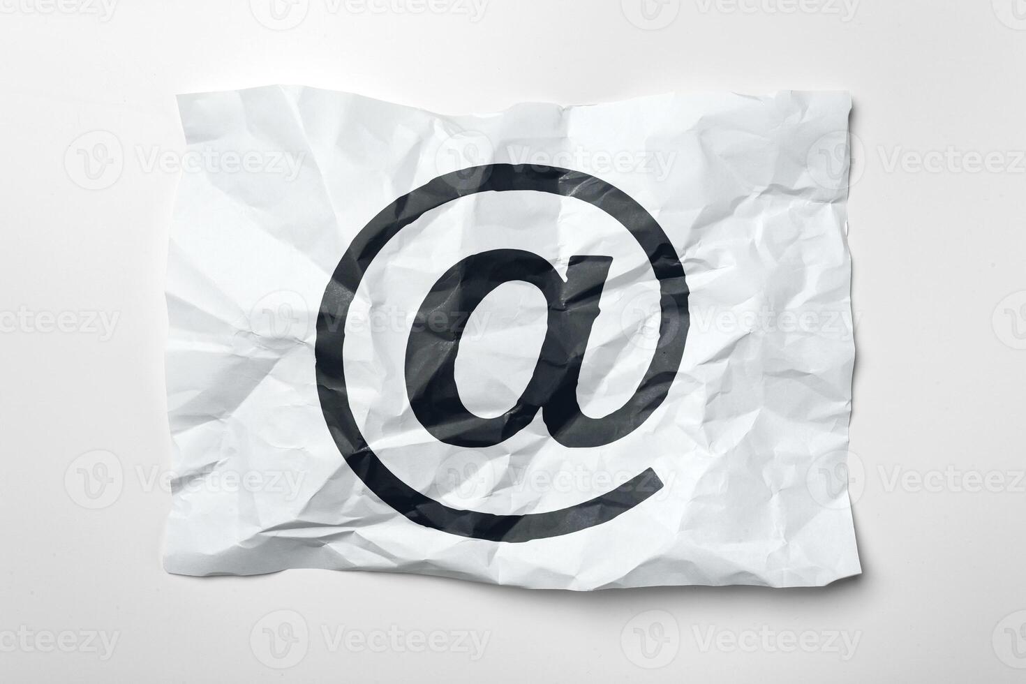 E-mail symbol on crumpled paper photo