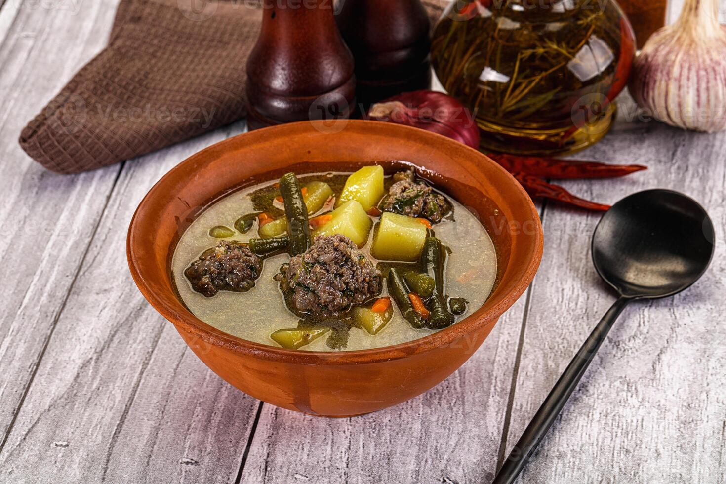 Soup with beef meatballs and vegetables photo