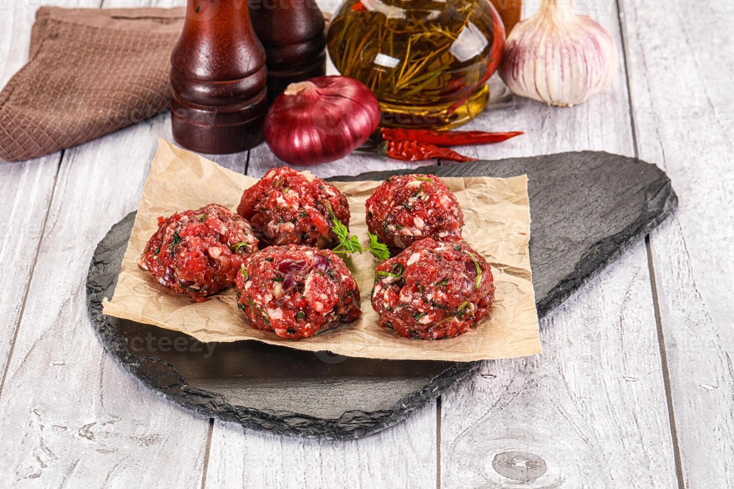 Raw beef meatballs for cooking photo
