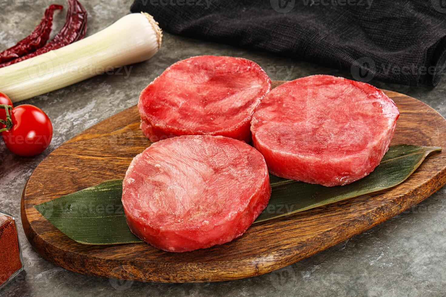 Delicous raw tuna medallion for cooking photo