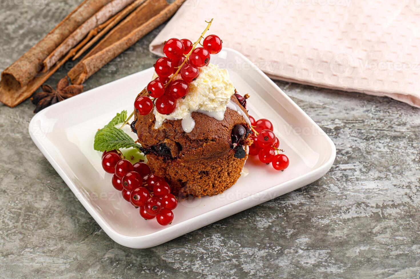 Delicous cupcake with red currant photo