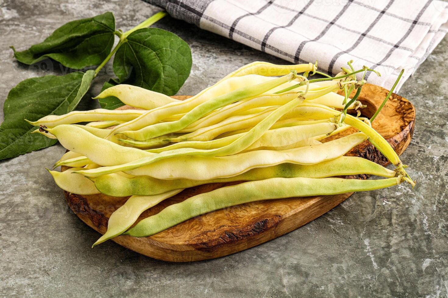 Raw green bean strings heap photo