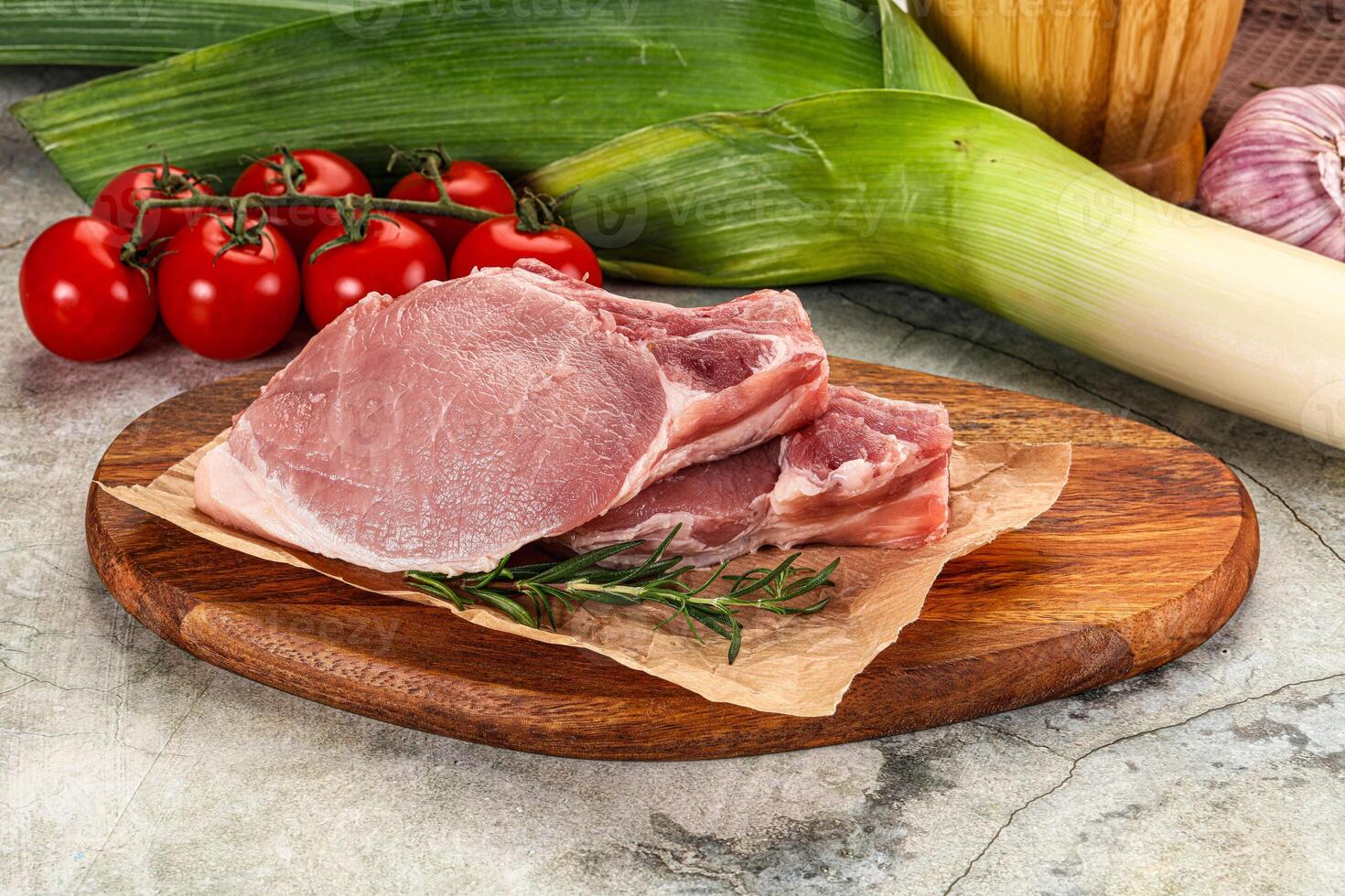Raw pork steak loin with bone photo