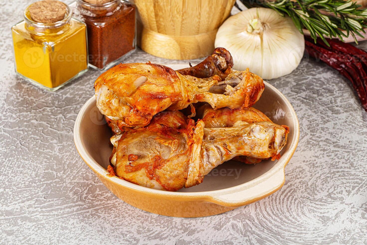 Raw marinated chicken drumstick for cooking photo