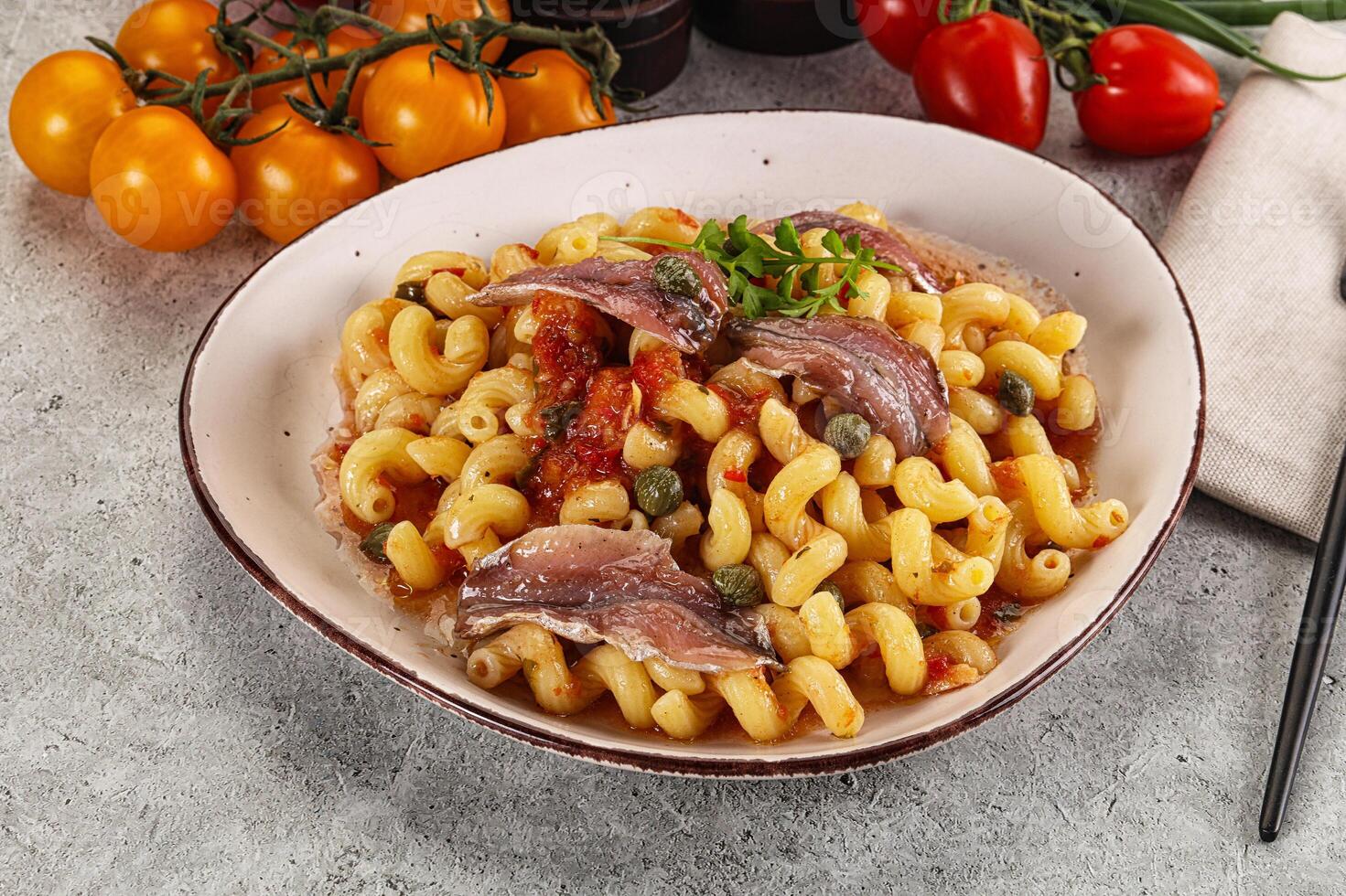 Italian pasta cellentani with anchovy photo